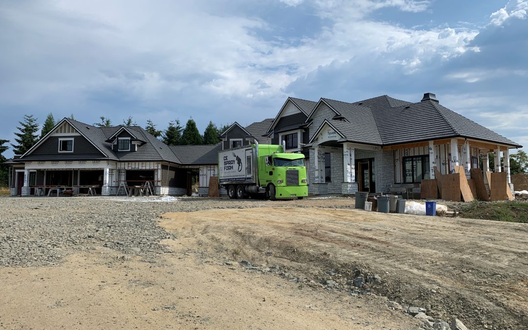 Truck in front of a custom home.